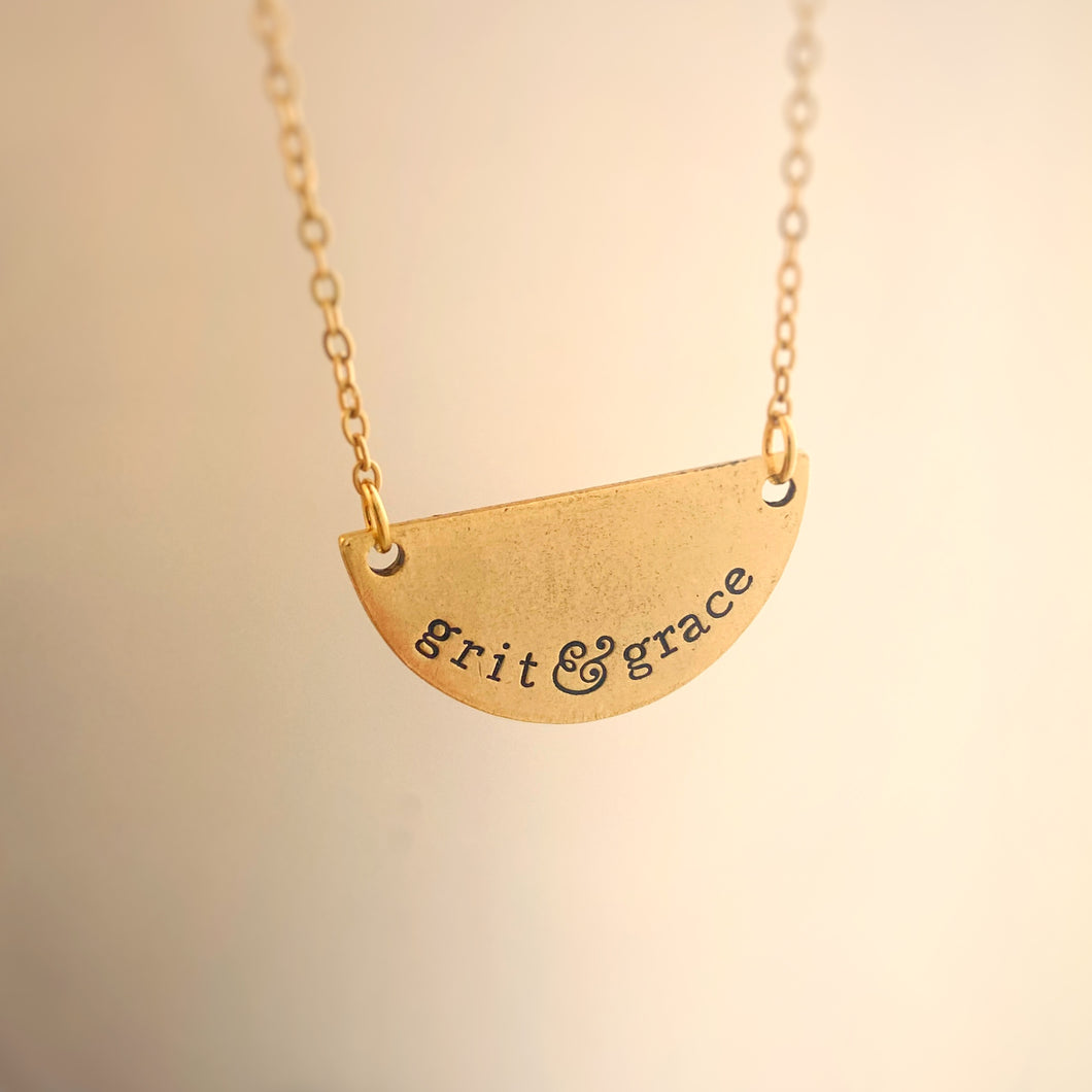 Gold half moon grit and grace necklace