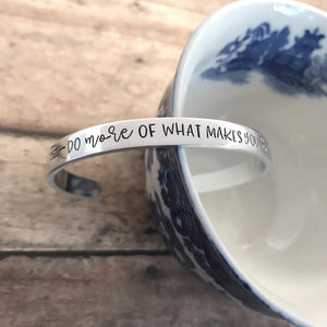 "Do more of what makes you happy" cuff