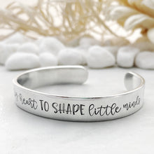 Load image into Gallery viewer, “It takes a big heart to shape little minds&quot; cuff
