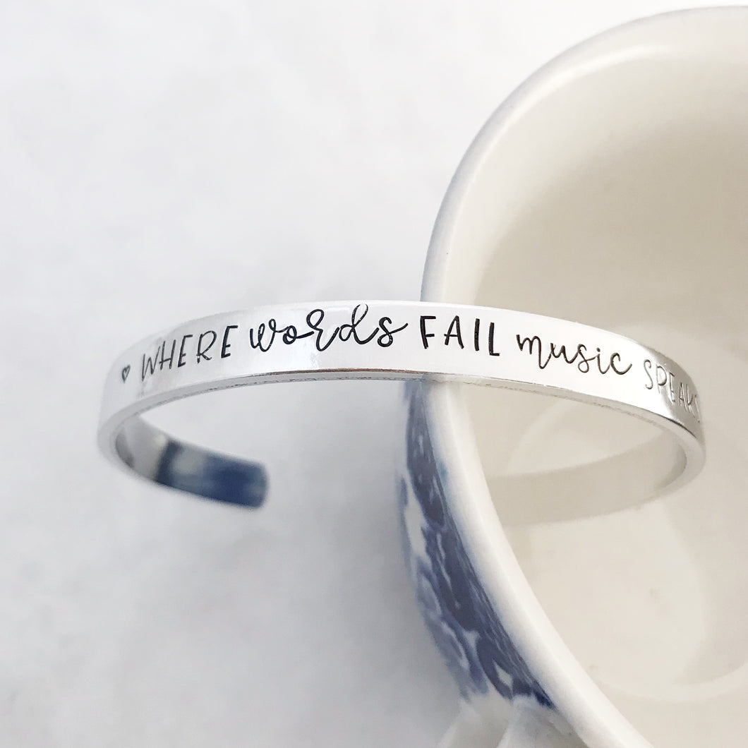 “Where words fail music speaks” cuff