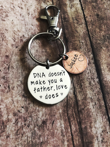 “DNA doesn’t make you a dad” keychain